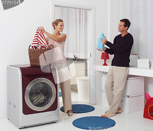 Image of dooing  laundry with washing machine