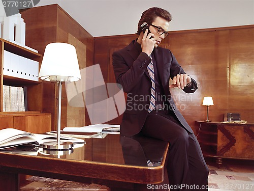 Image of Businessman working at office desk