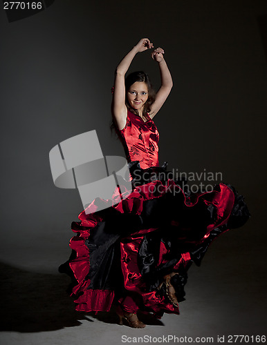 Image of Young woman dancing flamenco