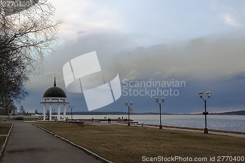 Image of Cloudy sky on landscape of lake quay