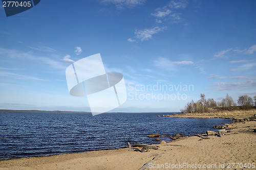 Image of Sandy beach on lake in sunny spring day