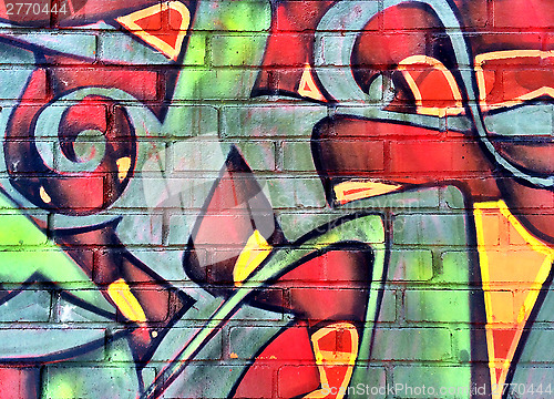 Image of Colorful graffiti detail on a brick wall