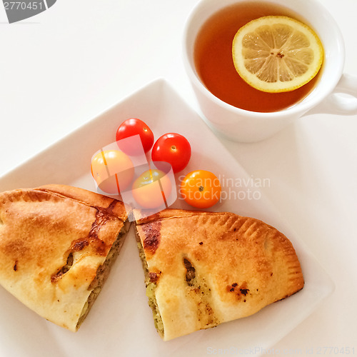 Image of Empanada and a cup of tea