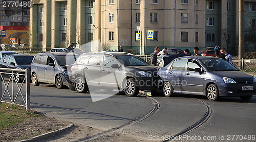 Image of accident involving four cars at a crosswalk