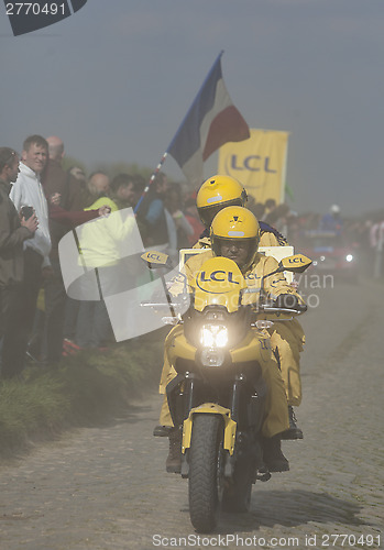 Image of The Yellow Bike in the Dust- Paris Roubaix 2014