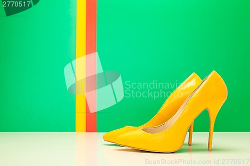 Image of pair of yellow high heels