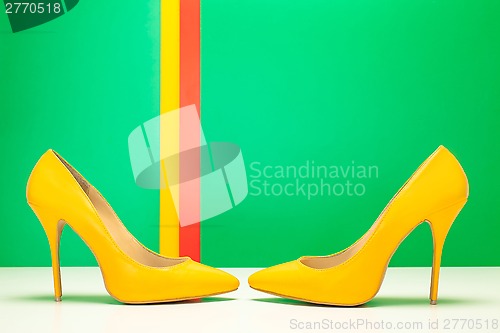 Image of pair of yellow high heels