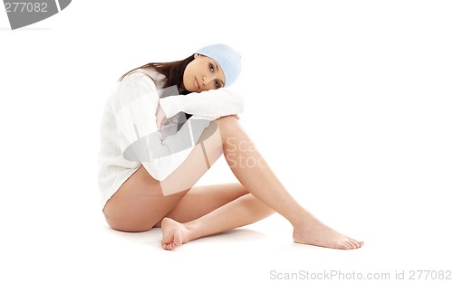 Image of brunette in winter hat and sweater