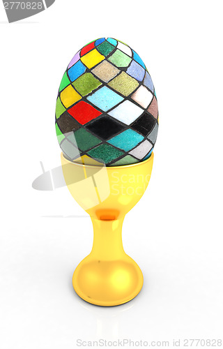 Image of Easter egg on gold egg cups