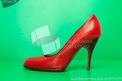 Image of single red high heels