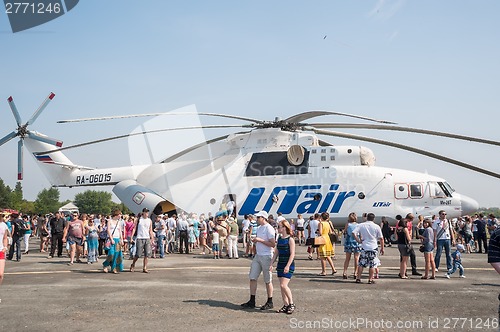 Image of People explore the MI-26T helicopter