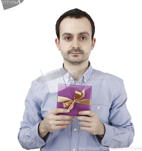 Image of Young man holding a present