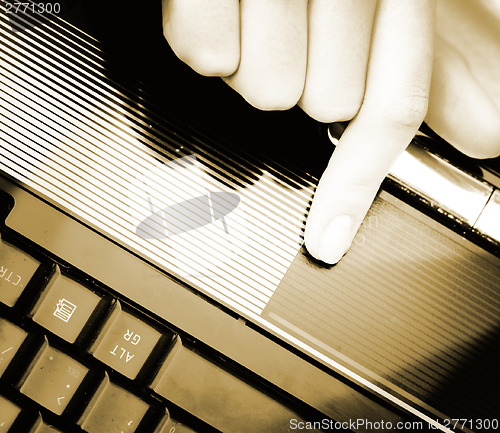 Image of Working at laptop .