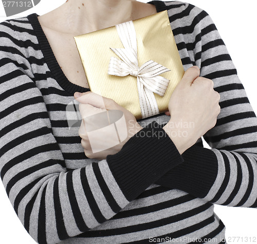 Image of Young woman holding a present