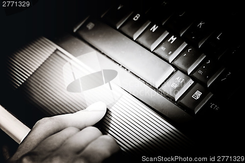 Image of Working at laptop .
