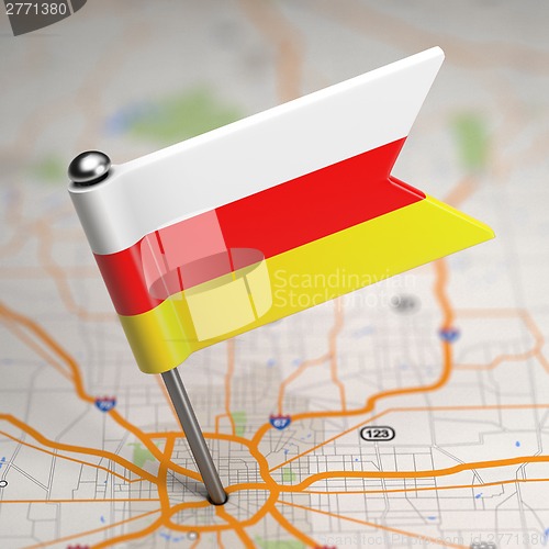 Image of South Ossetia Small Flag on a Map Background.