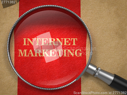 Image of Internet Marketing. Magnifying Glass on Old Paper.