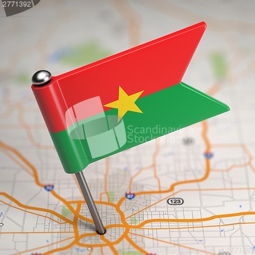 Image of Burkina Faso Small Flag on a Map Background.