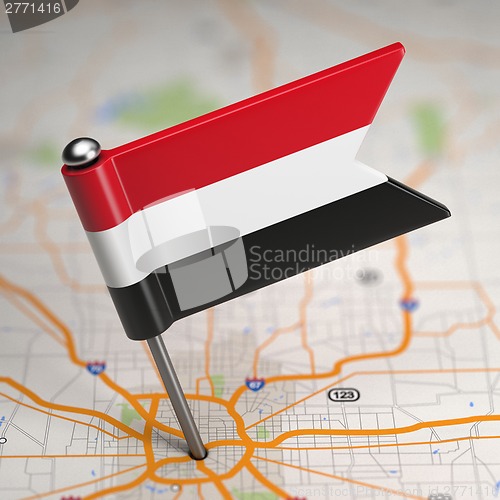 Image of Yemen Small Flag on a Map Background.