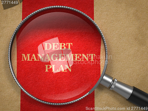 Image of Debt Management Plan. Magnifying Glass on Old Paper.