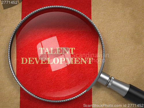 Image of Talent Development. Magnifying Glass on Old Paper.