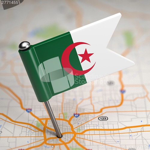 Image of Algeria Small Flag on a Map Background.