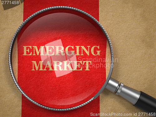 Image of Emerging Marketing. Magnifying Glass on Old Paper.