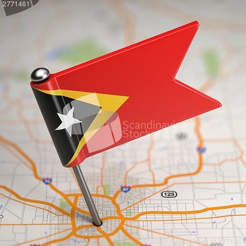Image of East Timor Small Flag on a Map Background.