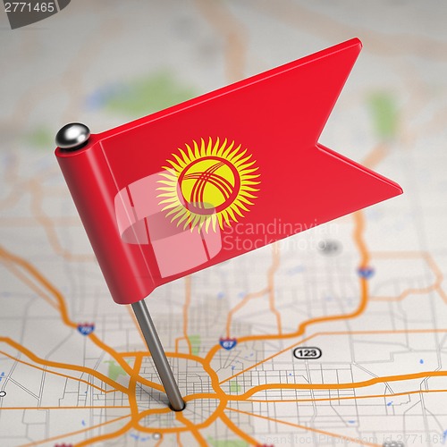 Image of Kyrgyzstan Small Flag on a Map Background.