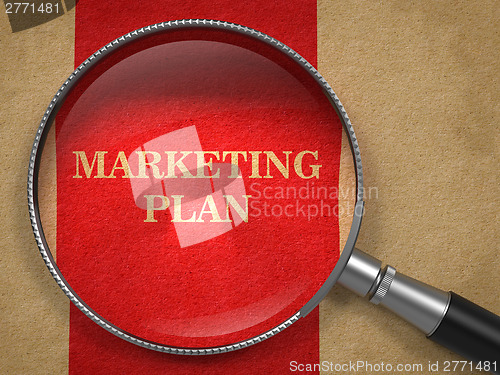 Image of Marketing Plan. Magnifying Glass on Old Paper.