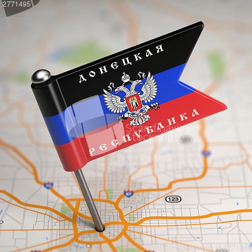 Image of Donetsk People's Republic Small Flag on a Map Background.