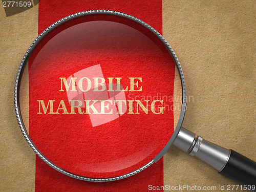 Image of Mobile Marketing. Magnifying Glass on Old Paper.