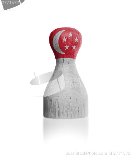 Image of Wooden pawn with a flag painting