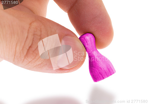 Image of Wooden pawn with a solid color painting
