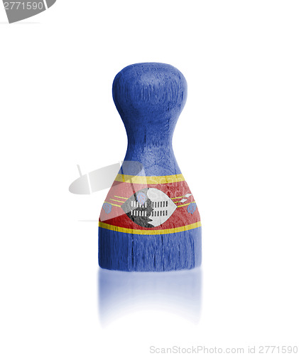 Image of Wooden pawn with a flag painting