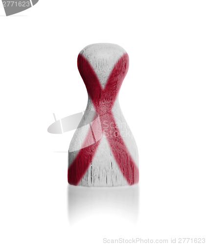 Image of Wooden pawn with a flag painting