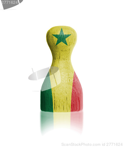 Image of Wooden pawn with a flag painting