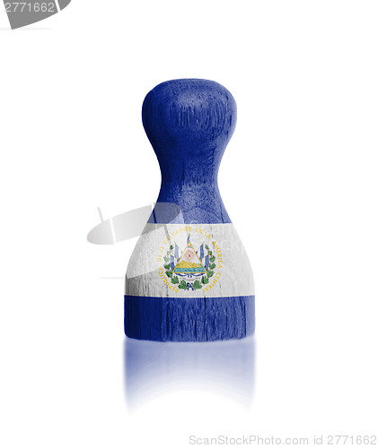 Image of Wooden pawn with a flag painting