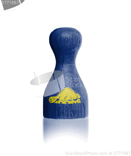 Image of Wooden pawn with a flag painting