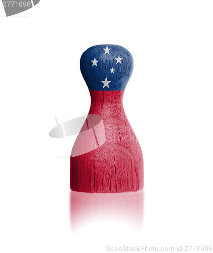 Image of Wooden pawn with a flag painting