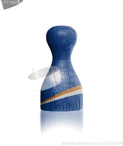 Image of Wooden pawn with a flag painting