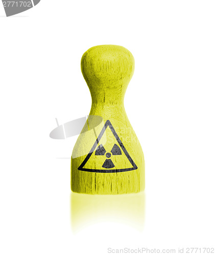 Image of Wooden pawn with a flag painting