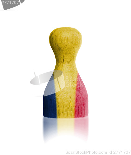 Image of Wooden pawn with a flag painting