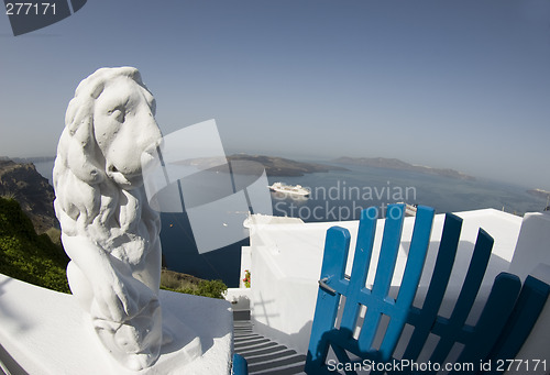 Image of statue over harbor santorini