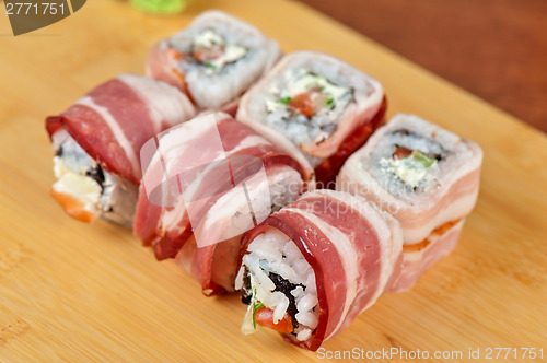 Image of Sushi roll with bacon