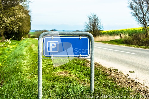 Image of Blue parking sign in nature