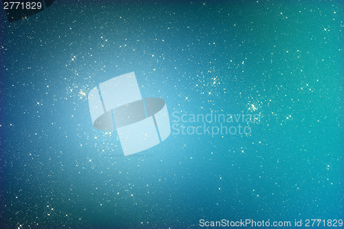 Image of Starry glitter background with stars on blue color