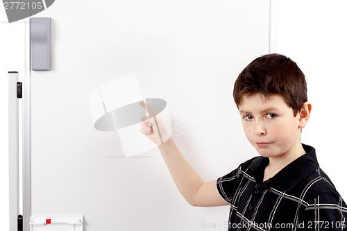 Image of young boy student and whiteboard