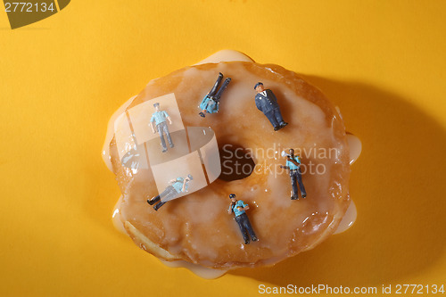 Image of Police Officers in Conceptual Food Imagery With Donuts