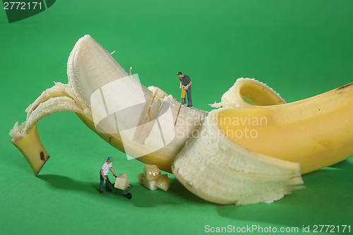 Image of Construction Workers in Conceptual Food Imagery With Banana